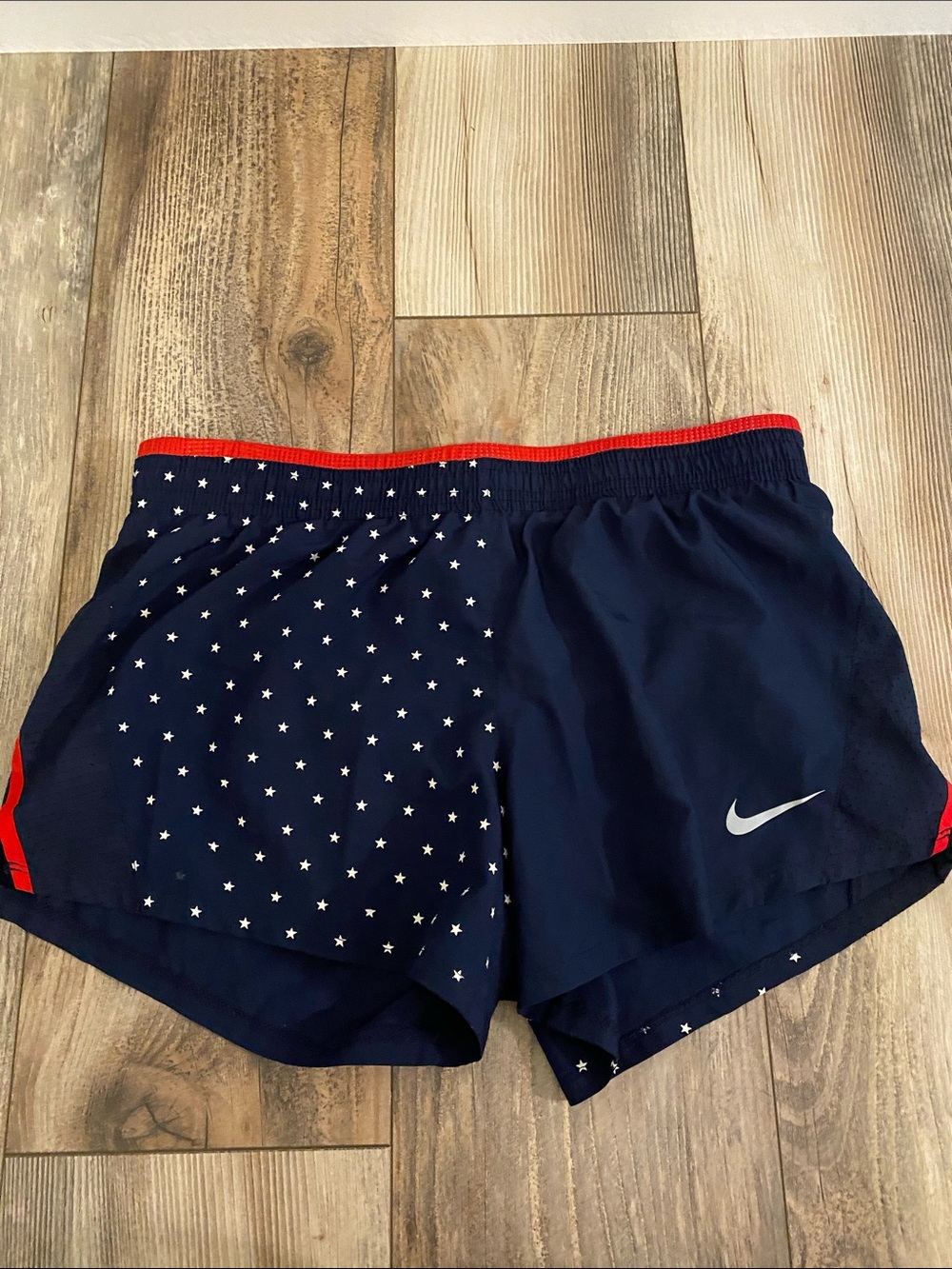 Nike Navy Athletic Shorts with Red Trim and Star Print